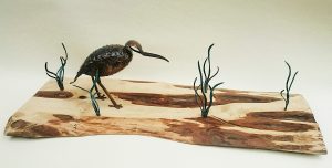 curlew on seashore sculpture