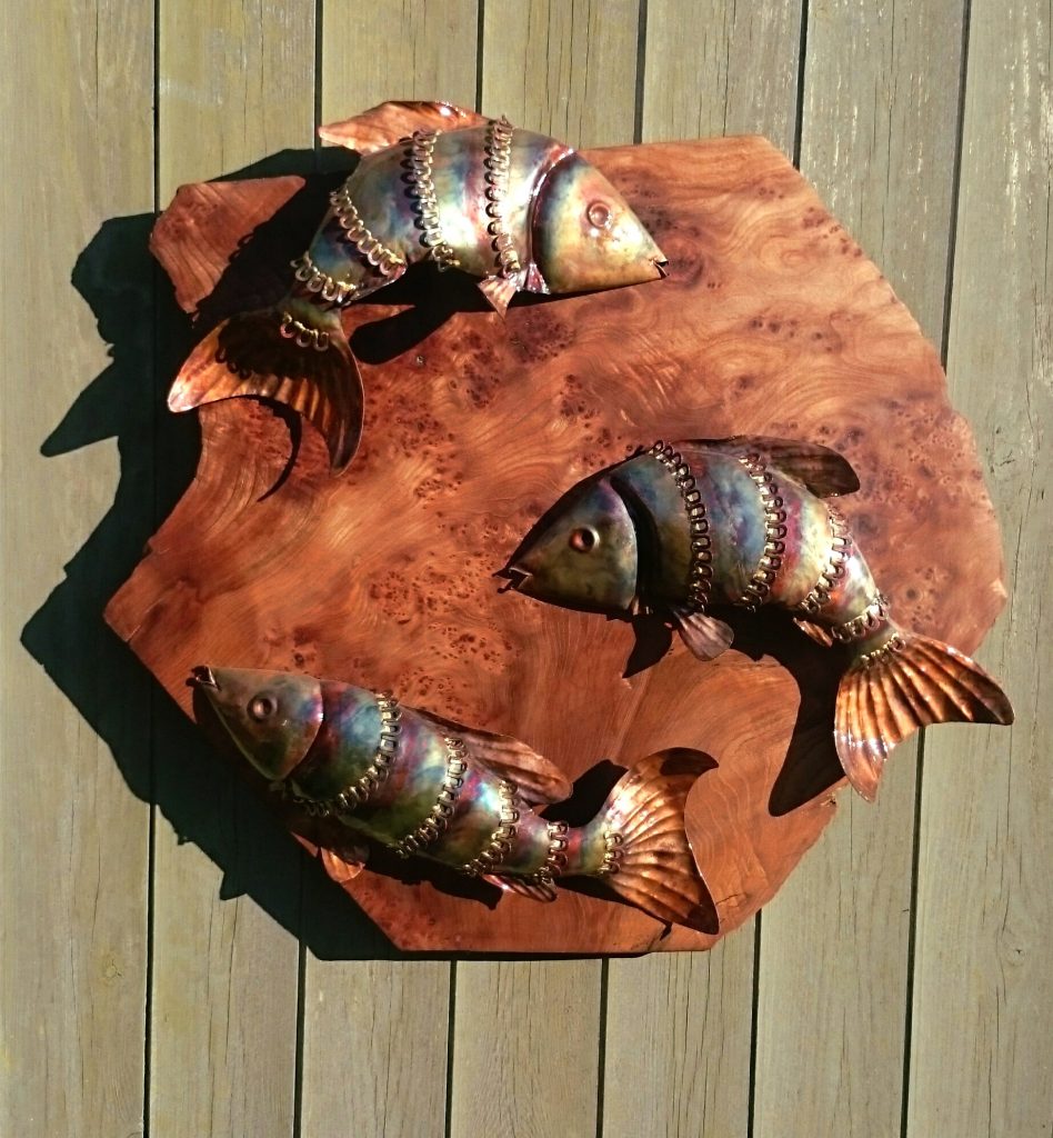 fish trio on wood sculpture