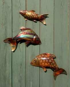 three fish sculptures