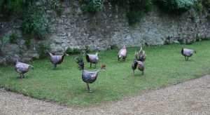 Cockerel and hens sculpture