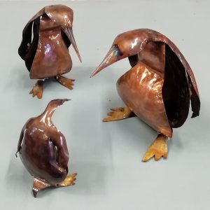 Emily Stone copper penguin sculptures