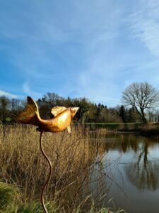 Emily Stone copper Fish on sticks sculpture Herstmonceux moat