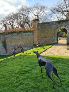 Emily Stone copper Greyhound and hares sculpture Herstmonceux