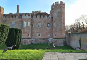 Emily Stone copper Greyhound and hares sculpture Herstmonceux